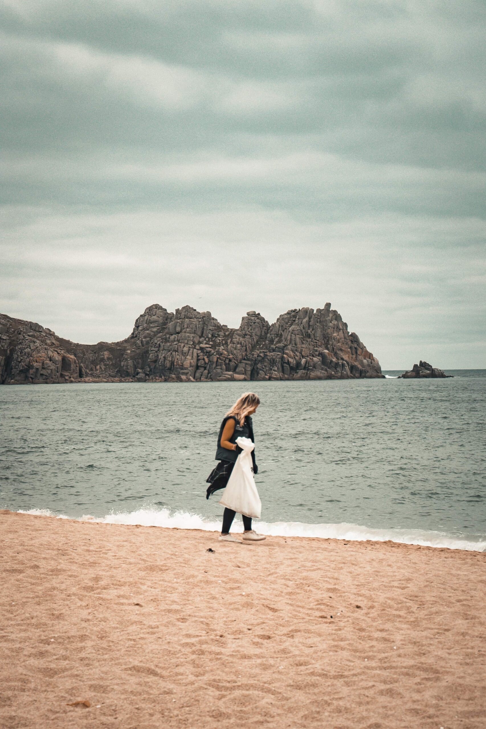 Woman doing a beach clean